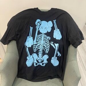 KAWS Black Tee with Sky Blue Skeleton Character Graphic